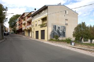 paesaggio con architetture e figure maschili e femminili